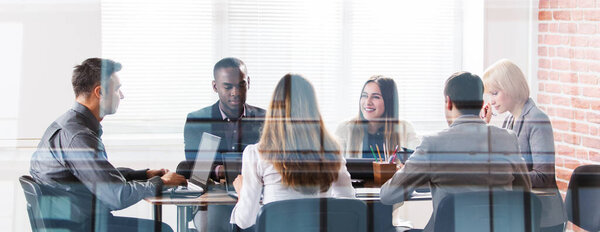 Diverse Group Of Businesspeople At Meeting In Office