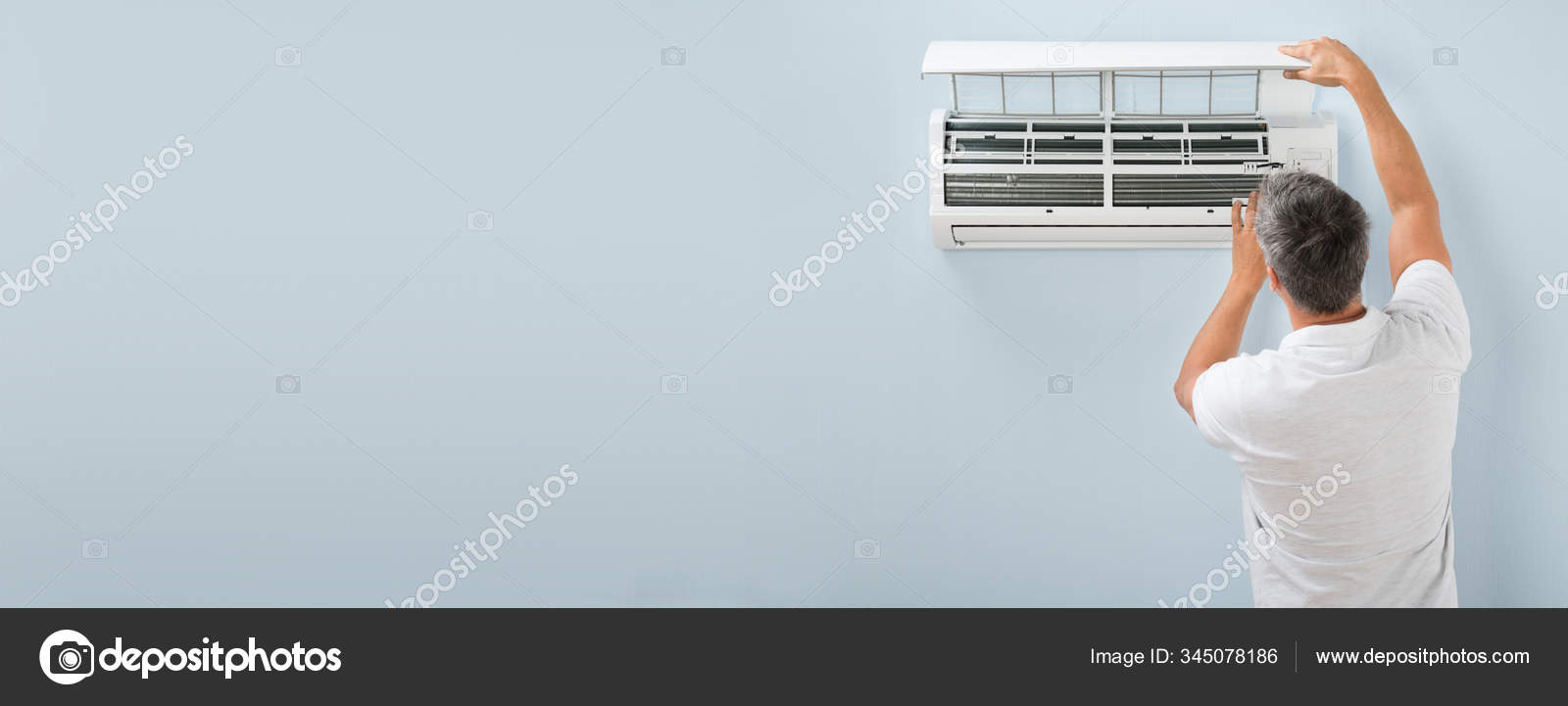 Man Adjusting Air Conditioning System Home ⬇ Stock Photo, Image by