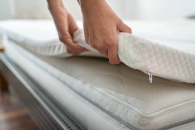 Mattress Topper Being Laid On Top Of The Bed clipart