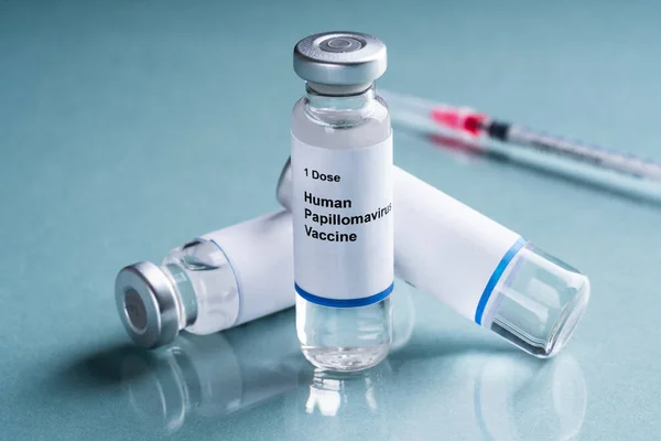 Human Papillomavirus Vaccine Bottles Syringe Turquoise Background — Stok Foto