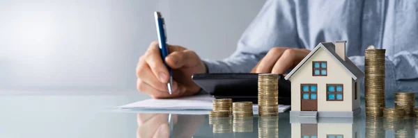 Businessman Calculating Tax Model House Coins — Stock Photo, Image