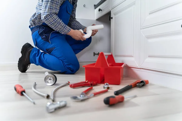 Male Plumber Overall Fixing Kitchen Sink Pipe — Stock Photo, Image