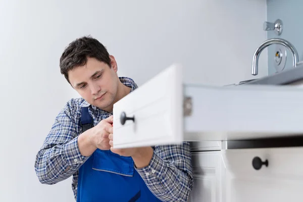 High Angle View Male Carpenter Fixing Drawer Kitchen — стоковое фото