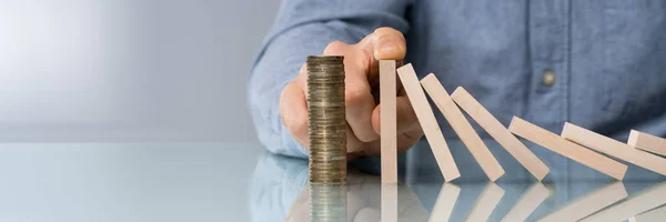 Close Human Hand Stopping Wooden Blocks Falling Stacked Coins Desk — Stok Foto