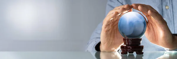 Midsection Businessman Covering Crystal Ball Wooden Table — Stock Photo, Image