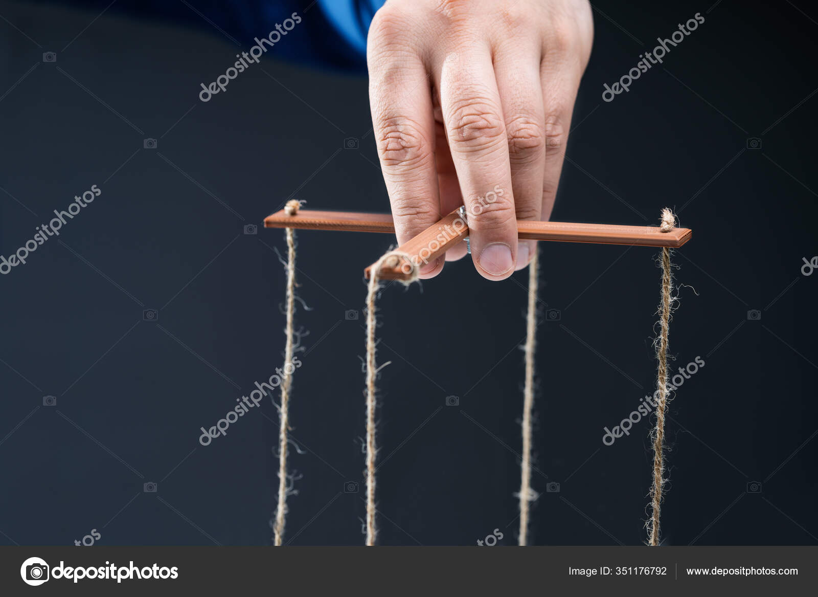 Close Businessperson's Hand Manipulating Marionette String Stock Photo by  ©AndreyPopov 351176792