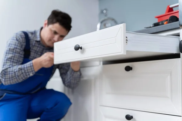 High Angle View Male Carpenter Fixing Drawer Kitchen — стоковое фото