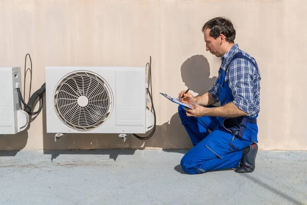 Man Doing Heating, Ventilation, And Air Conditioning Inspection