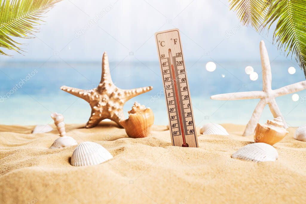 Close-up Of Thermometer On Sand Showing High Temperature