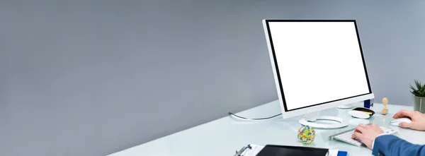 Stock image Close-up Of A Businessman Using Computer With Blank Screen At Workplace