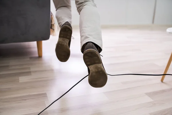 Close Man Legs Stumbling Electrical Cord Home — Stock Photo, Image