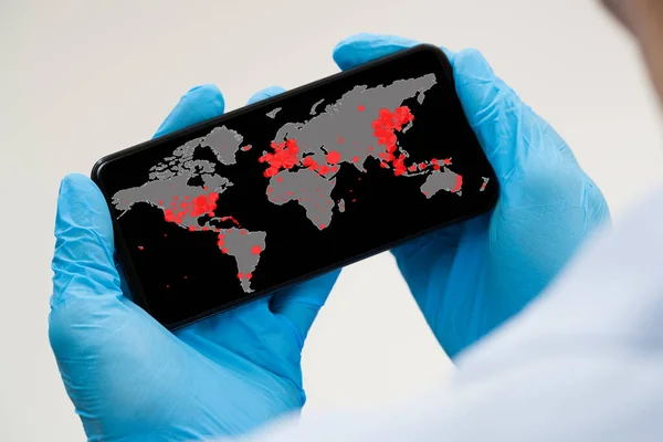 Checking Coronavirus Infection Worldwide Map On Smartphone