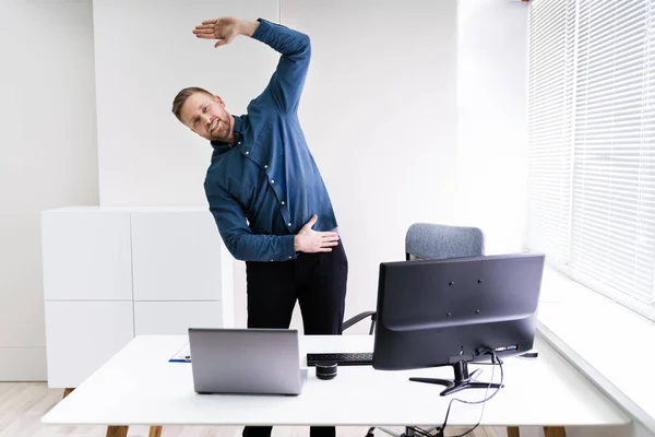 Young Businessman Doing Stretching Exercise Office — Stock Photo, Image