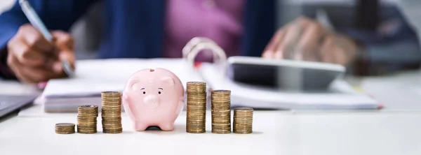 Close Businessman Calculating Bill Piggybank Stacked Coins Desk Office — Stock Photo, Image