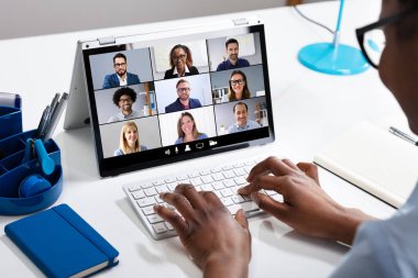 Woman Working From Home Having Group Videoconference On Laptop clipart