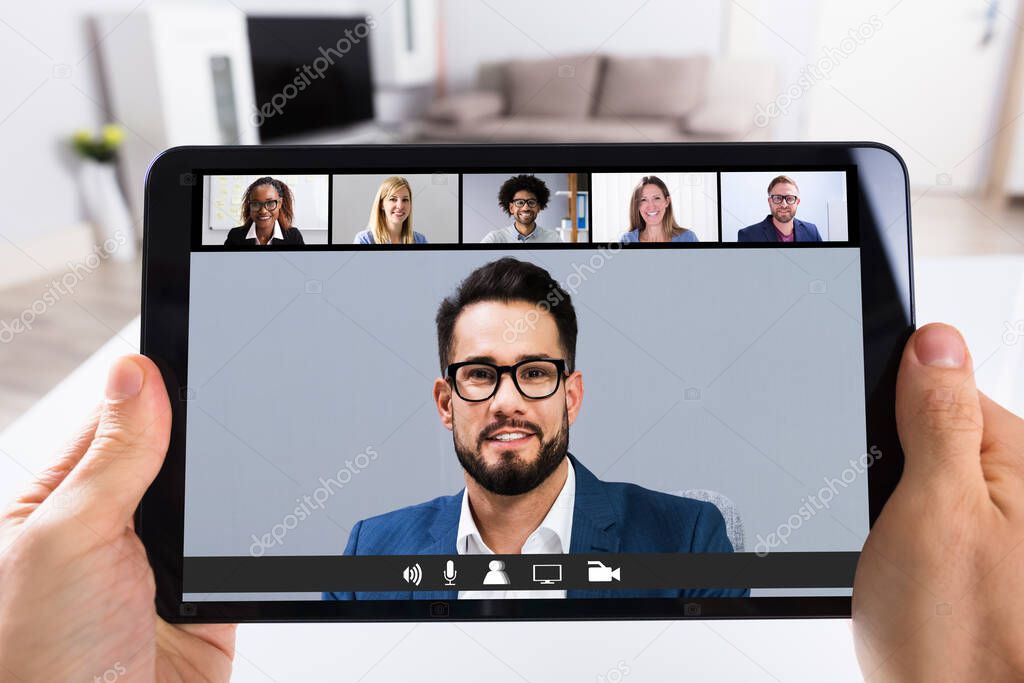 Man Working From Home Online Group Videoconference On Tablet