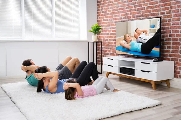 Fit Family Doing Home Online Fitness Exercise — Stock Photo, Image