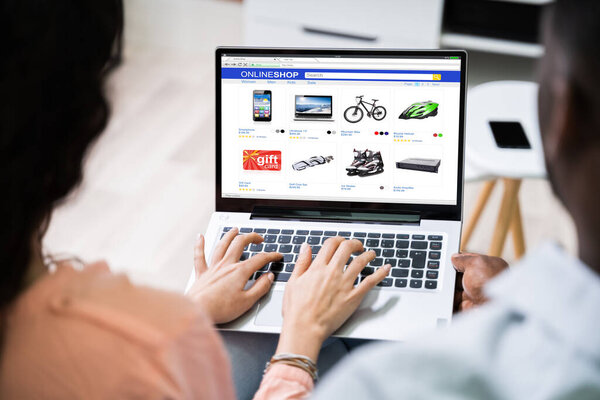 Close-up Of An Couple Shopping Online On Tablet