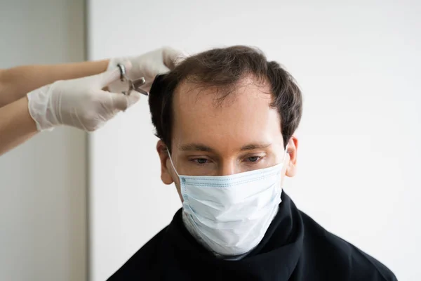 Man Cutting Short Hair At Salon In Face Mask