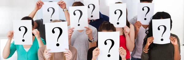 Confused Student Group Holding Question Marks Asking Questions — Stock Photo, Image