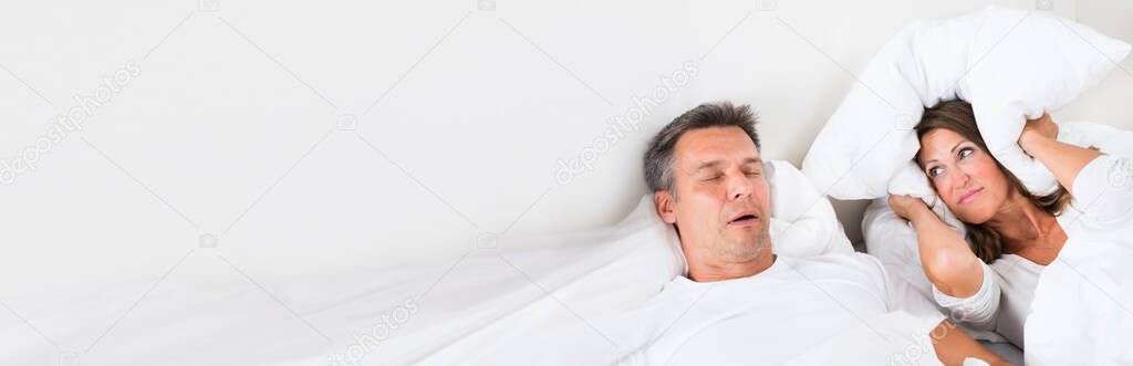 Snoring Man Sleeping With Apnea And Sleepless Woman