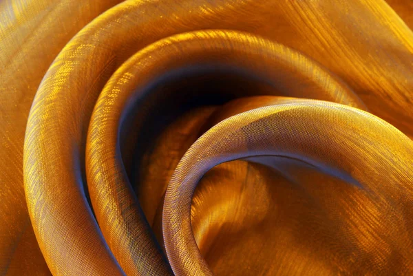 Golden organza fabric wavy texture — Stock Photo, Image