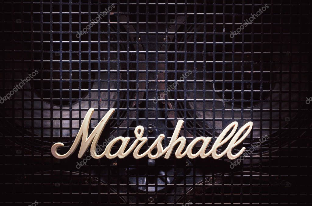 Cacak, Serbia - December 13, 2017: Marshall logo on old bass speaker with metal net in front of woofers.