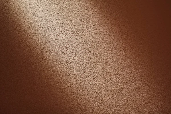 Details van bleke oranje muur gedeeltelijk verlicht — Stockfoto