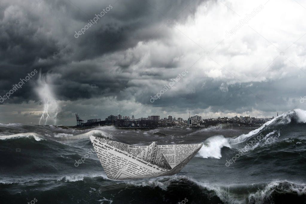 Landscape with large storm waves. The city. Paper boat