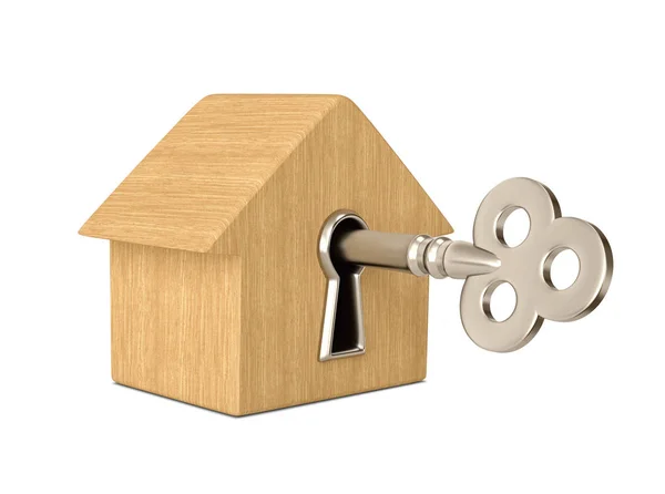Деревянный дом с ключом в замочной скважине — стоковое фото