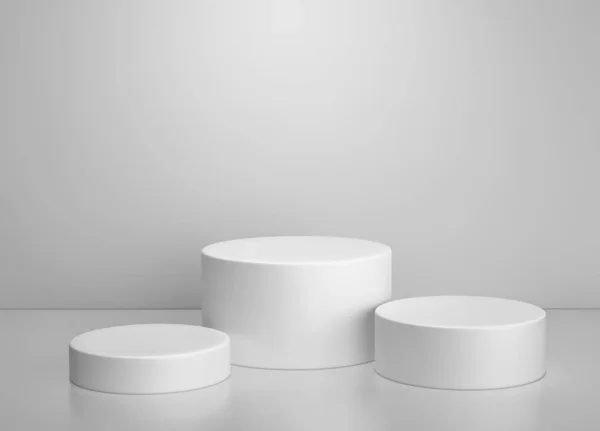 Beyaz silindir podyumu, ürün standının gri arkaplan üzerinde durması — Stok fotoğraf