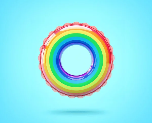 Regenboog gekleurde opblaasbare ring op blauwe achtergrond. Knipsel — Stockfoto