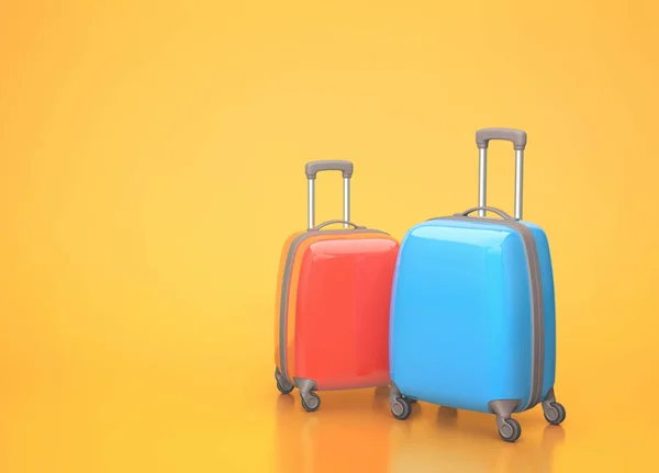 Dva cestovní kufry na oranžovém pozadí — Stock fotografie