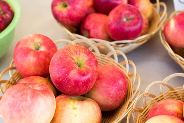 Apples in basket on table — Stock Photo, Image