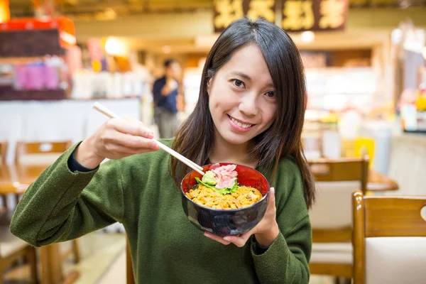 Woman having urchin rice bowl — Stock Photo, Image