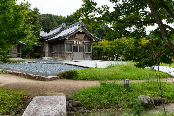 Wooden house in garden — Stock Photo, Image