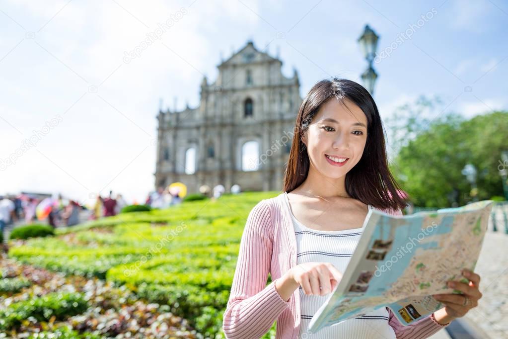 Woman searching the location in map