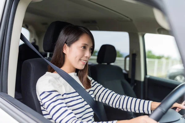 Young woman driving her car — Stock Photo, Image