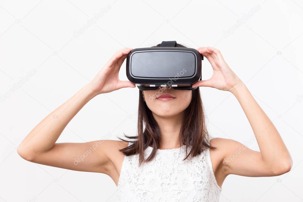 Woman looking though VR device