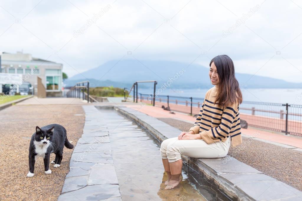 Cute street cat and young woman