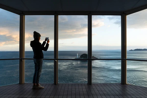 Silhouette of Woman taking photo — Stock Photo, Image