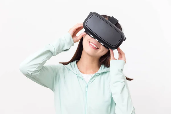 Woman looking though virtual reality device — Stock Photo, Image