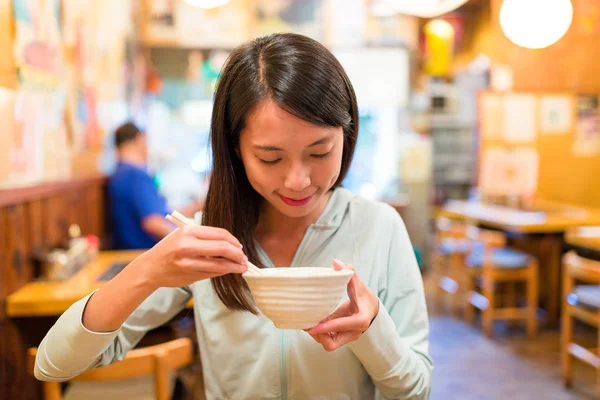 Woman enjoy her rice bowl in restaurant — Stock Image Woman enjoy her rice bowl in restaurant Stock Picture