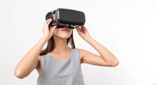 Woman watching though Virtual reality glasses — Stock Photo, Image