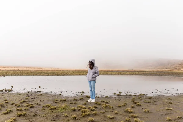 Woman in marsh at winter — Stock Photo, Image