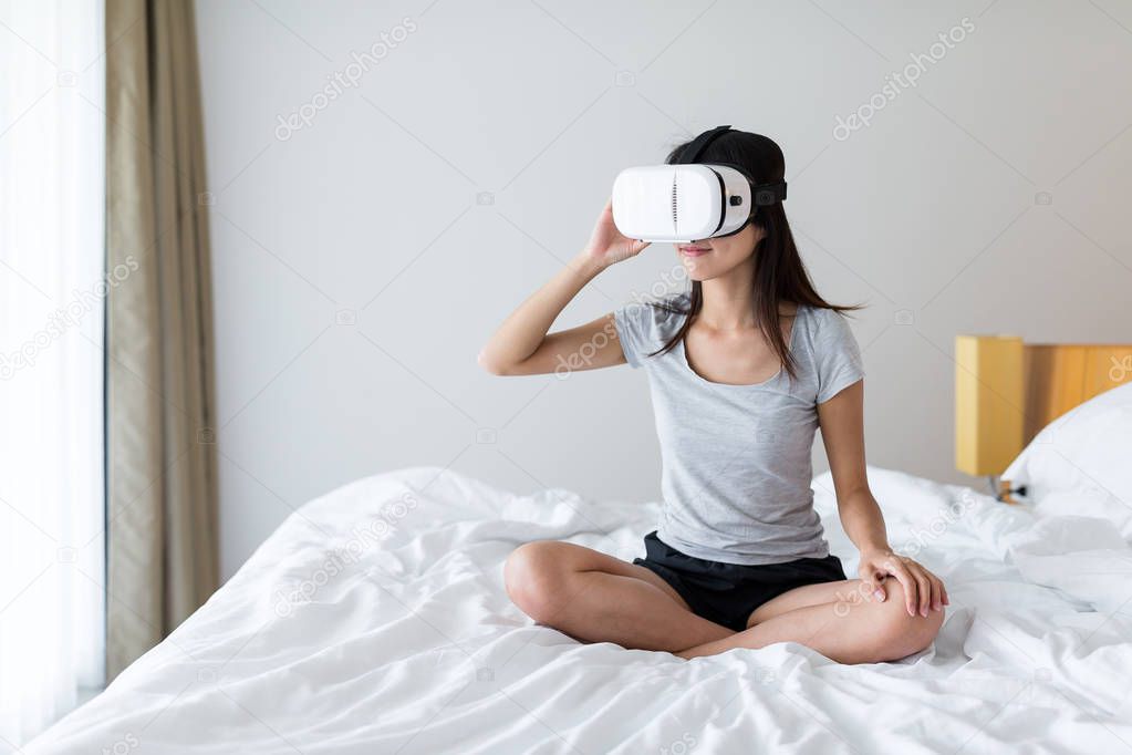 Woman looking though the virtual reality device 