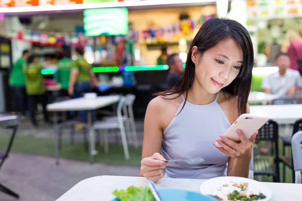 Woman looking at mobile phone