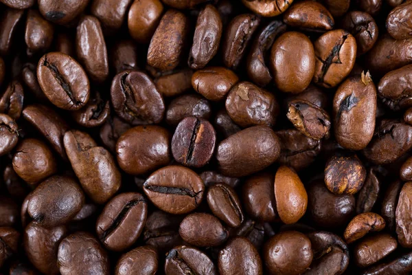 Смажений коричневий фон кавових зерен — стокове фото