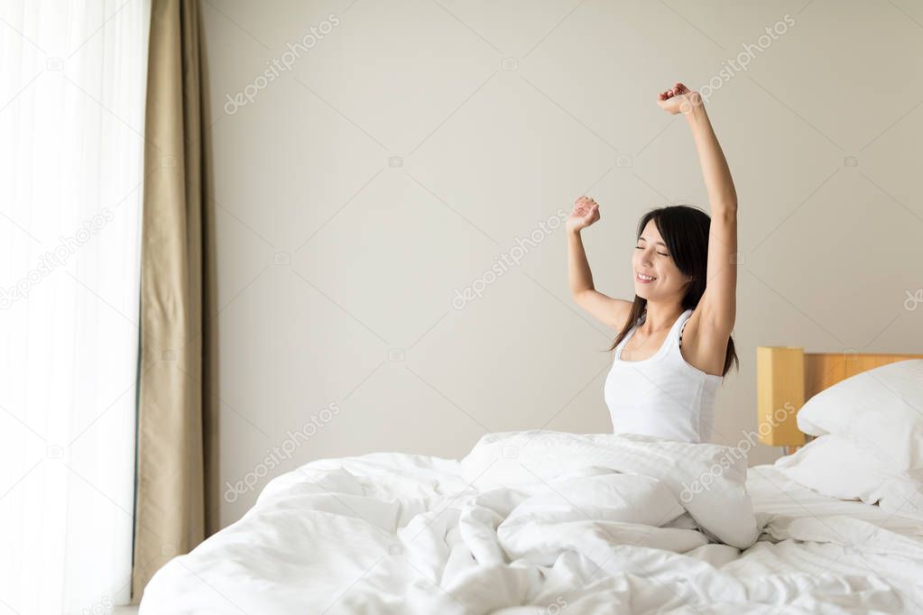 Woman wake up at morning