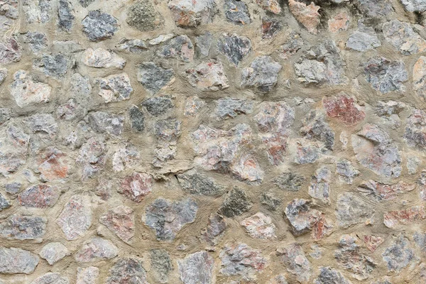 Рок кам'яною стіною — стокове фото